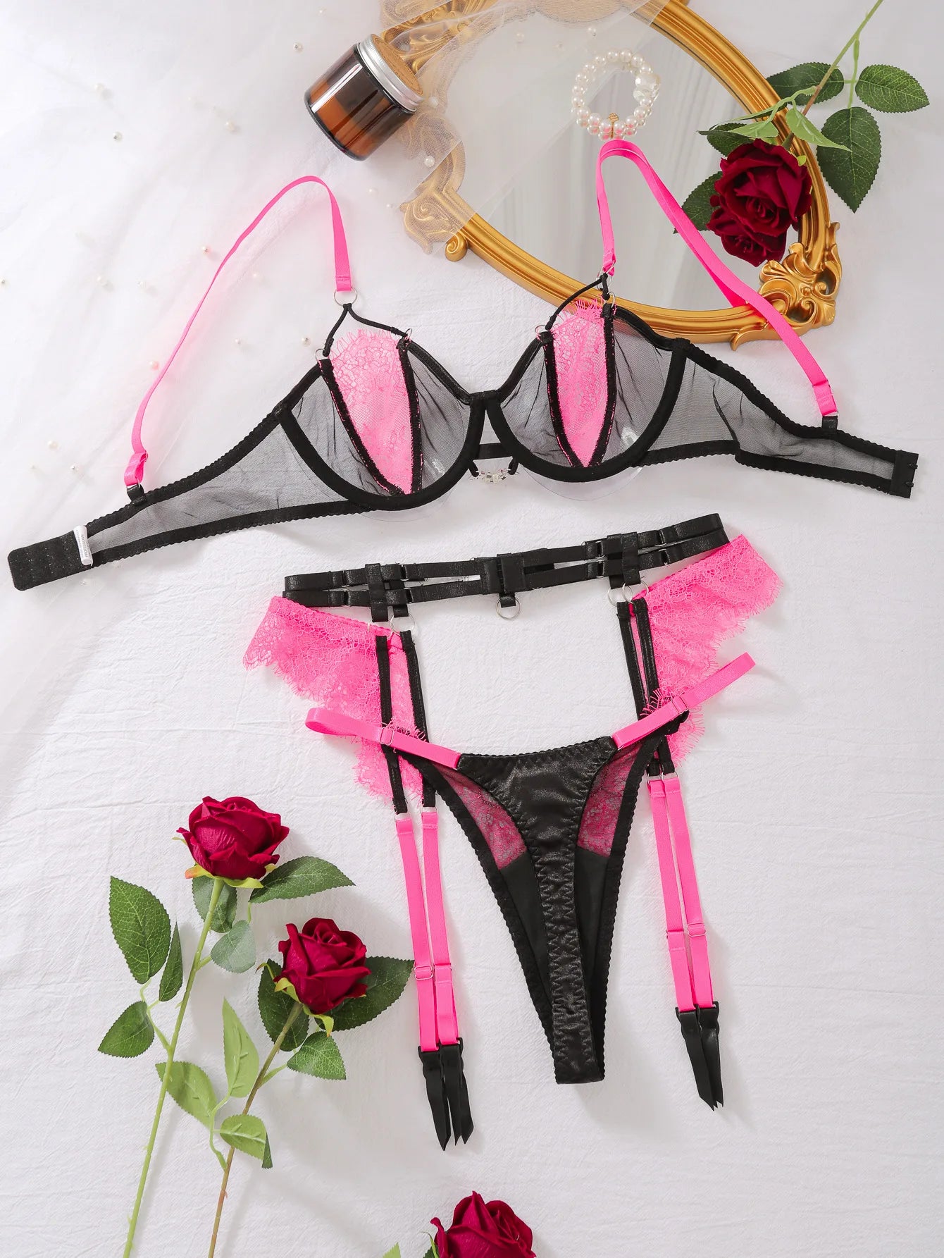 Léa's Secrets Dessous-Set aus schwarzer und rosa Spitze mit Strumpfband