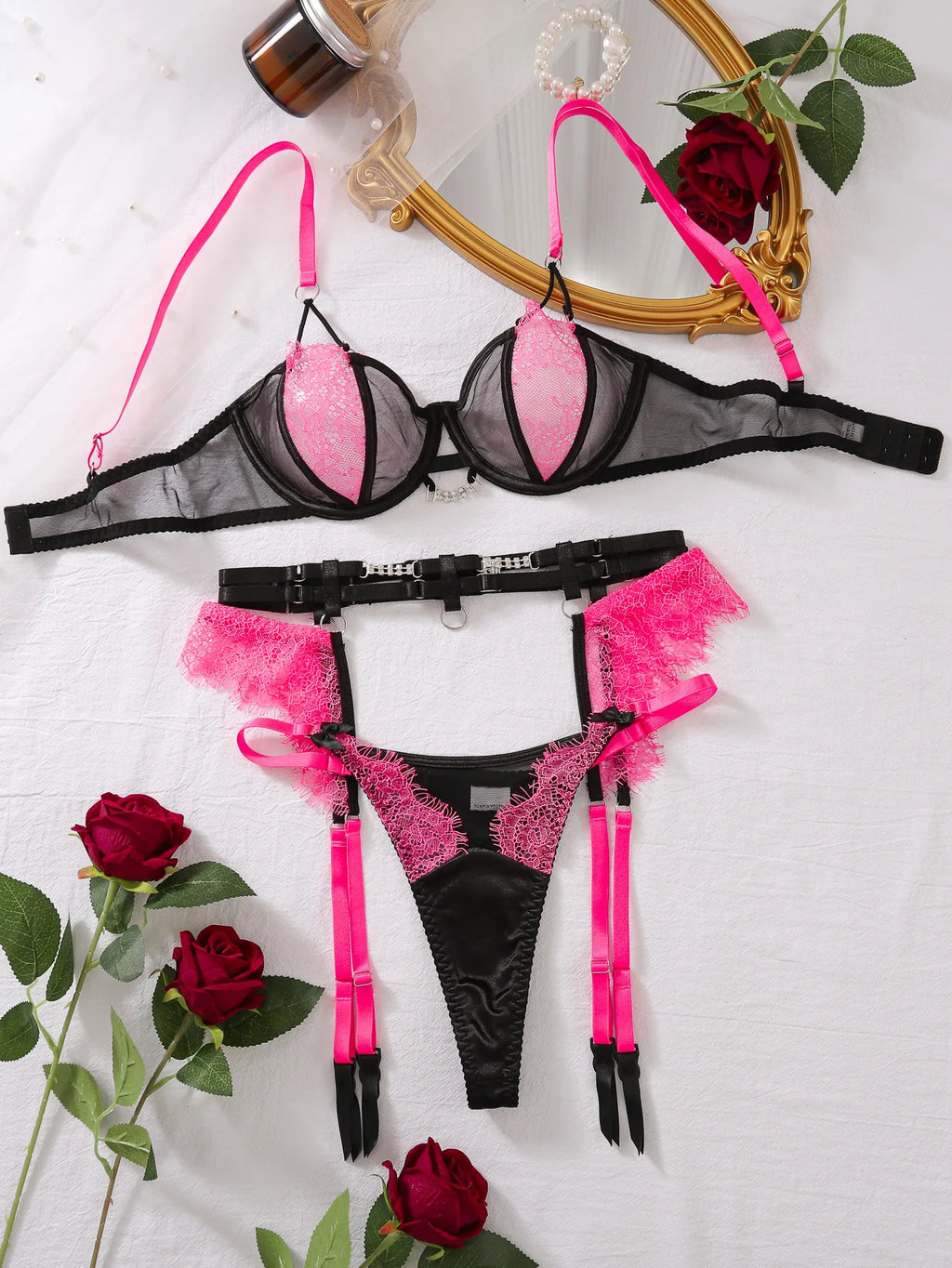 Léa's Secrets Dessous-Set aus schwarzer und rosa Spitze mit Strumpfband