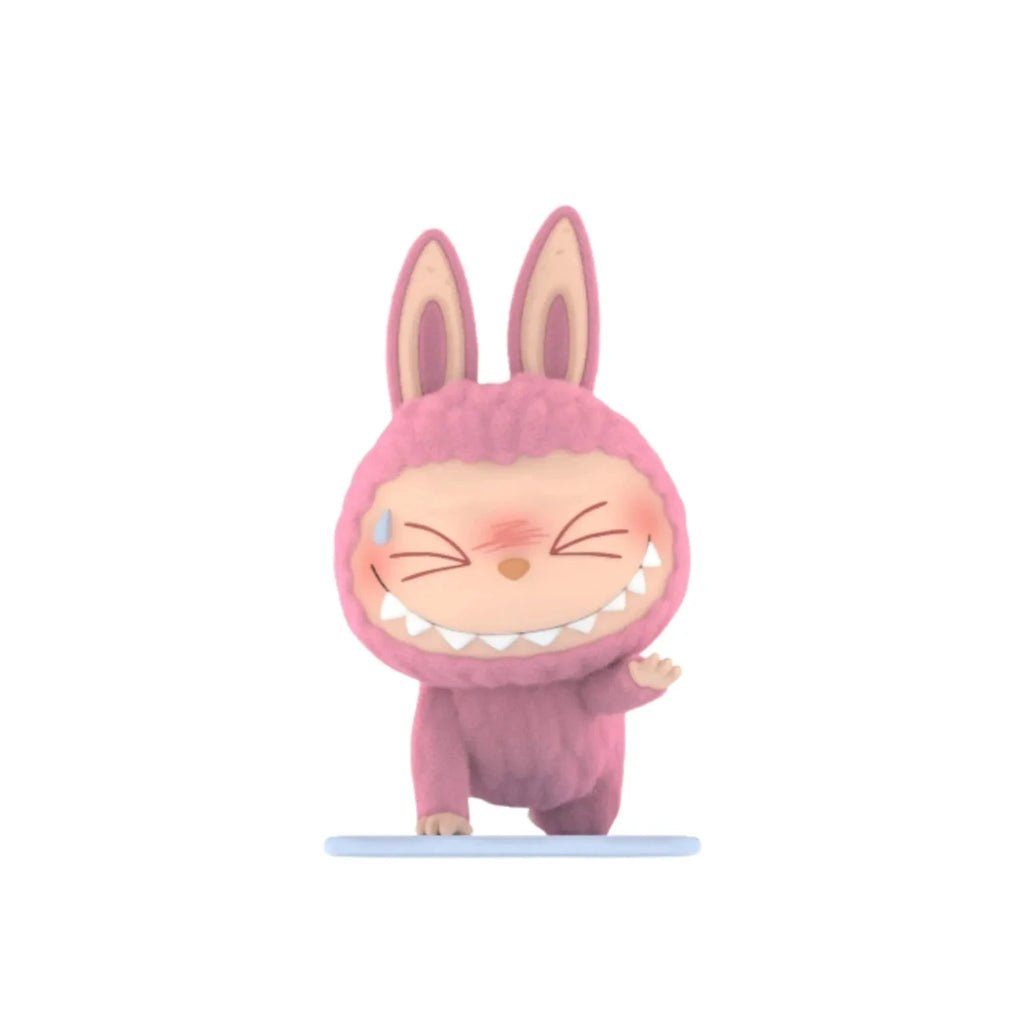 Mon Labubu figurine: pink bunny from The Monsters Lazy Yoga Labubu, standing on a light blue base